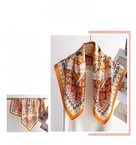 Detailed shot of retro floral silk scarf draped on hanger with elegant glossy texture