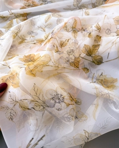 Close-up of semi-transparent floral print scarf showing lightweight chiffon fabric detail