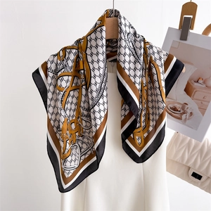 Elegant silk scarf with classic horsebit chain print and monogram logo pattern