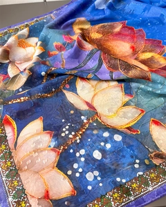 Detail of colorful lotus floral print on premium silk scarf with royal blue background