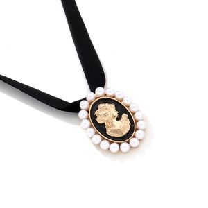 French vintage choker with black velvet ribbon and faux pearl lady cameo pendant