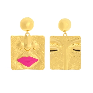 Artistic gold-plated asymmetric face earrings with vibrant pink lips relief on white base