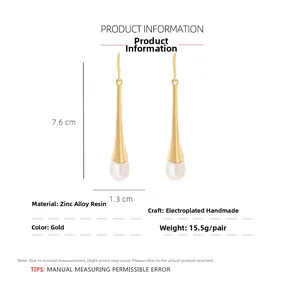 Dimensions détaillées des boucles d'oreilles pendantes en perles et métal doré