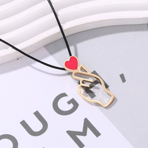 Vintage French heart hand gesture pendant with red enamel on a black adjustable cord