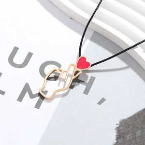 French vintage heart pendant necklace with gold hand gesture and red enamel on black cord