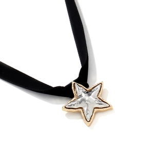 Retro velvet choker with a dual-tone gold and silver star pendant for a vintage look