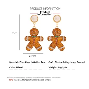 Detailed size guide for gingerbread man earrings with dimensions 5cm by 2.7cm