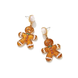 Detailed close-up of gingerbread man enamel earrings with glitter finish and faux pearls