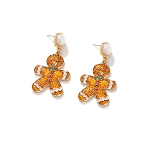 Detail of Christmas gingerbread man earrings with gold metal and glitter finish