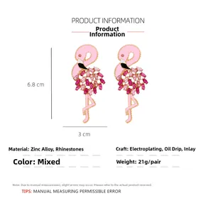 Detail of pink enamel flamingo earrings with magenta crystal rhinestones and alloy plating