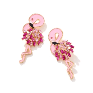 Close-up of flamingo earrings with pink enamel and marquise-cut crystal inlays