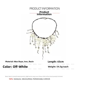 Detail view of handcrafted off-white floral waterfall necklace with 65cm cord length