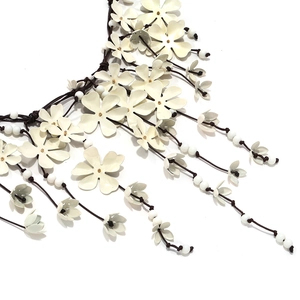 Waterfall fringe necklace with creamy white floral petals and gold-toned core accents