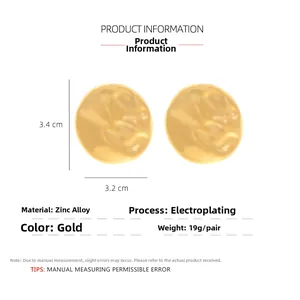 Close-up of golden hammered round zinc alloy earrings with dimensions 3.4cm x 3.2cm