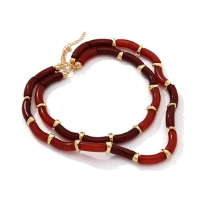 Double-layered beaded necklace featuring reddish-brown resin beads and gold metal accents