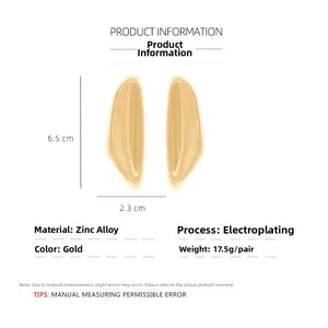 Detailed view of irregular fluid gold earrings with exact size and material specs