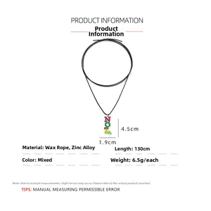 Detailed view of colorful NOA letter pendant on a 130cm adjustable black wax cord necklace
