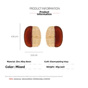 Detail view of vintage amber resin earrings with dimensions of 4.8cm by 3.8cm