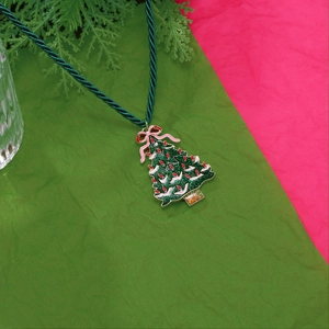 Christmas tree pendant necklace with green glitter and red bow on a festive rope chain