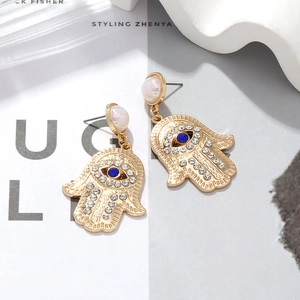 Bohemian gold Hand of Fatima drop earrings with colorful crystals and faux pearls