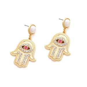 Detail of Hamsa Hand earrings with evil eye, pink gemstone and sparkling rhinestones