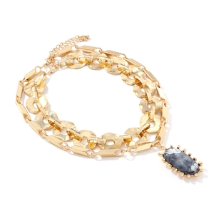 Double layer gold chain necklace featuring a grey marble stone pendant and mixed geometric links