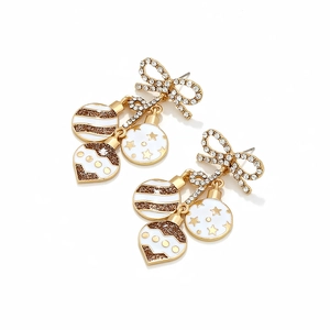 Detailed view of Christmas bow earrings with three festive enamel and rhinestone balls