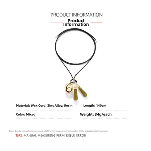 Detail of 140cm adjustable necklace with resin buds and gold zinc alloy bells
