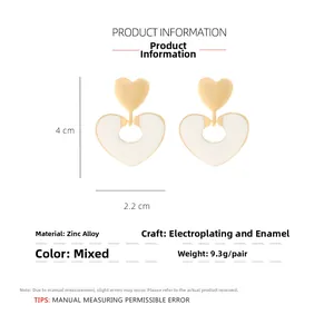 Detail view of heart-shaped drop earrings showing 4cm height and 2.2cm width dimensions