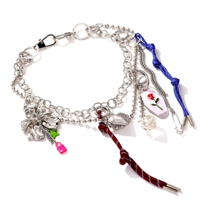 Y2K layered necklace with pink lock heart charms and mixed metal chains on white background