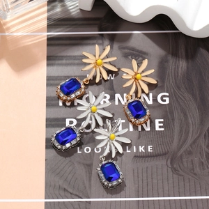 Elegant daisy floral drop earrings with navy blue crystal glass and rhinestone accents