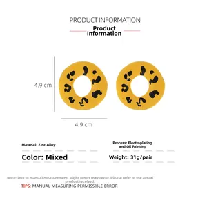 Detail view of round leopard print earrings with alloy plating and enamel oil finish