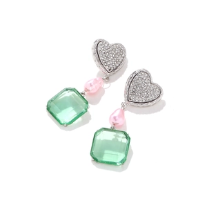 Sparkling heart earrings with pink pearl and green resin drop on a white background