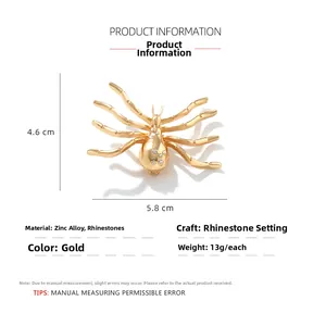 Detailed view of gold spider brooch with dimensions 5.8cm by 4.6cm in rhinestone zinc alloy