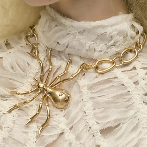 Exaggerated spider pendant necklace with sparkling crystals on a thick chunky chain