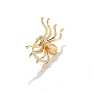 Luxury gold-plated spider ring with sparkling crystals on a minimalist white background