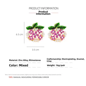 Detail of colorful enamel hydrangea earrings with sparkling rhinestones and green leaves