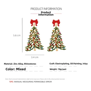 Detailed view of Christmas tree earrings with size dimensions 5.6cm by 3.4cm and rhinestones