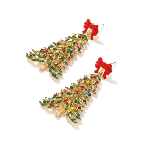 Exaggerated gold Christmas tree earrings with colorful rhinestones and red bows