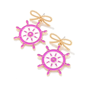Gold bow nautical helm earrings with purple enamel detailing in a fashionable dangle style