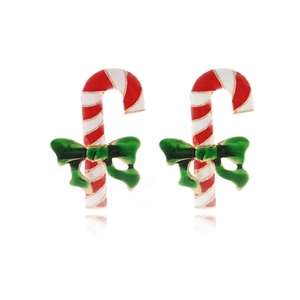 Festive candy cane earrings with red white stripes and a green bow on white background