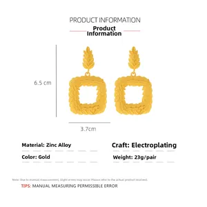 Detail view of gold alloy geometric earrings with vintage olive leaf texture and dimensions