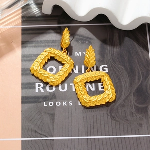 Vintage golden olive leaf geometric pendant earrings with leaf cluster square drop design