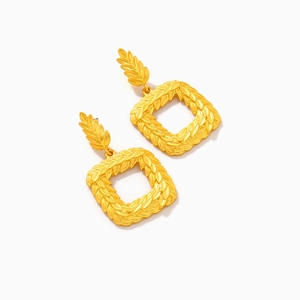 Golden square olive leaf dangle earrings with textured laurel pattern on white background