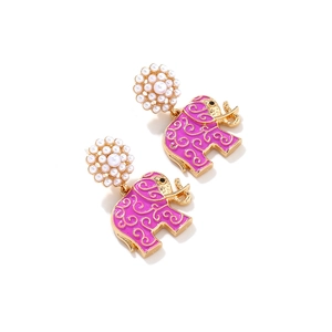 Detail of elephant earrings with purple enamel coating and faux pearl flower studs