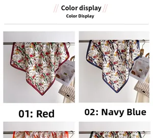 Detail view of floral print silk scarves in red and navy blue with elegant magazine props