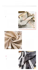 Close-up of geometric chain pattern silk scarf showing hemmed edges and smooth fabric texture