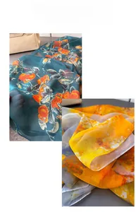 Close-up of lightweight floral chiffon scarves in blue and yellow artistic prints