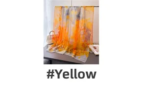 Artistic printed orange and yellow long scarf made of lightweight translucent fabric