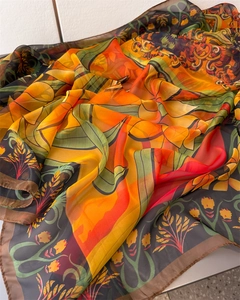 Detail of floral print chiffon scarf with vintage flowers and brown rolled edges